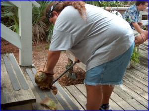 Eric husking a coconut